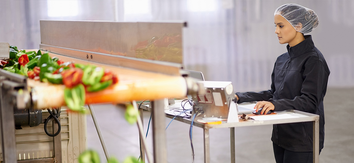 A woman monitoring and checking food supply in a warehouse