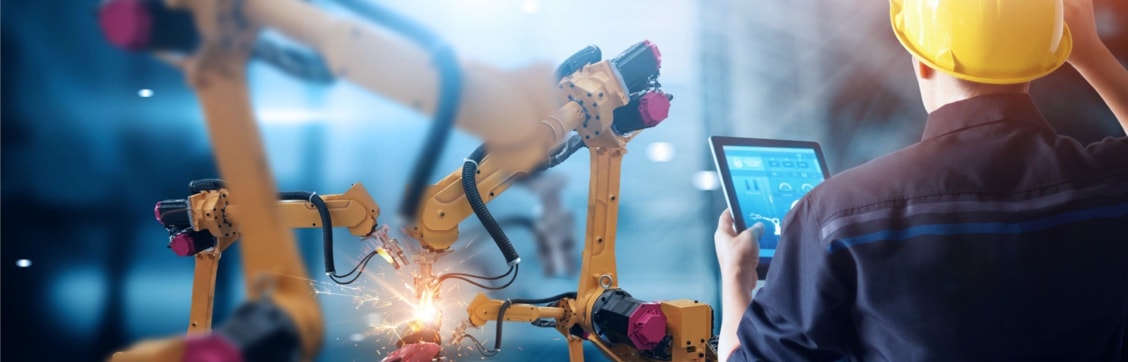 Man with tablet on manufacturing floor