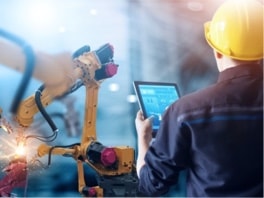 Man with tablet on manufacturing floor